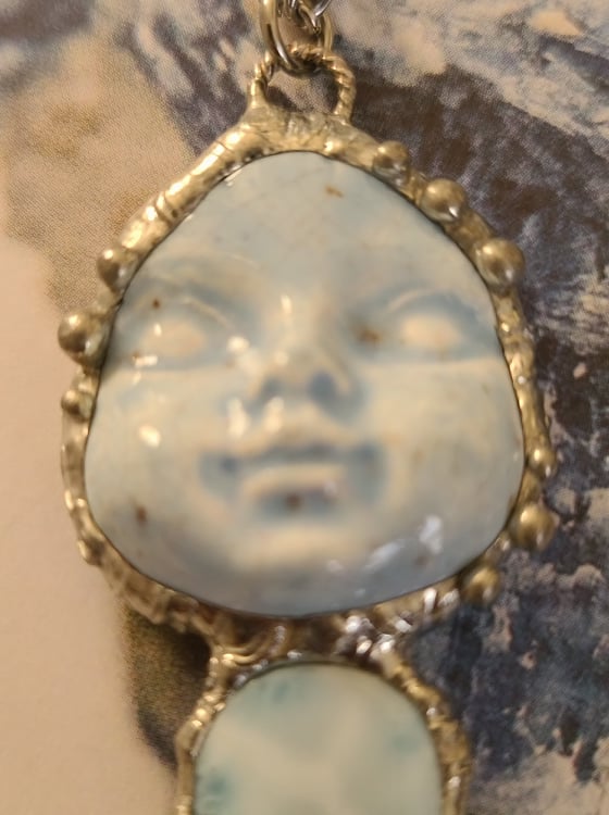 Ceramic Doll Face and Larimar Pendant
